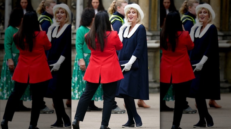 Joanna Lumley navy dress and white hat