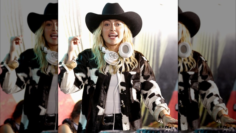 Brandi Cyrus wearing cow print coat