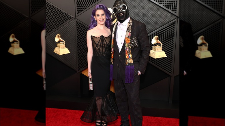 Kelly Osbourne and Sid Wilson wearing mask