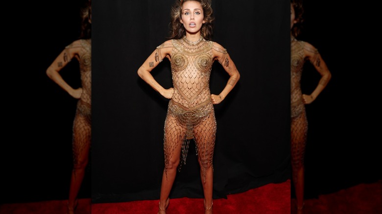 Miley Cyrus in gold mesh dress