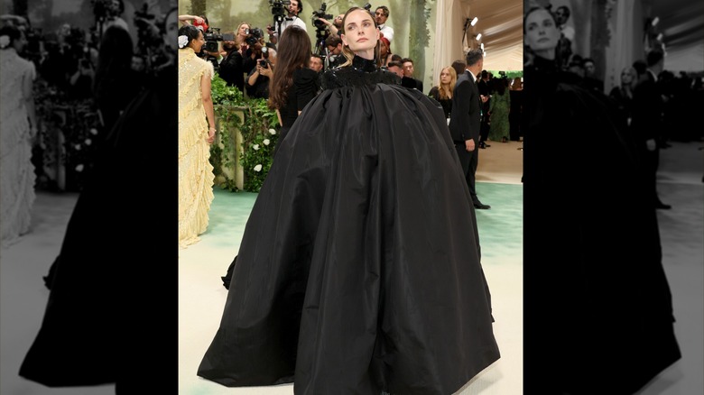 Rebecca Ferguson black puffy cape