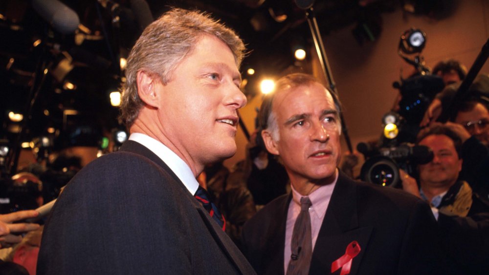 Bill Clinton and Jerry Brown posing for cameras