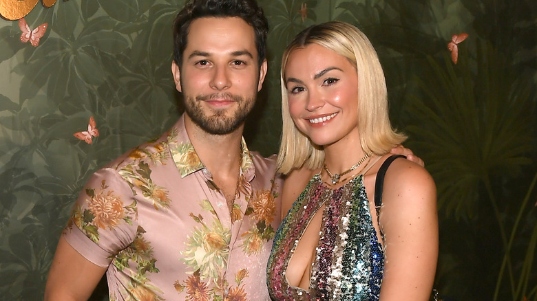 Skylar Astin and Lisa Stelly posing