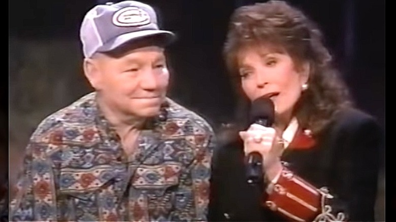 Loretta Lynn singing next to Oliver Lynn