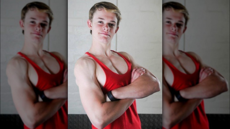 Cosmo Taylor shows off his muscles at 14