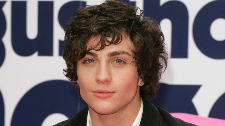 Aaron Taylor-Johnson poses in 2008