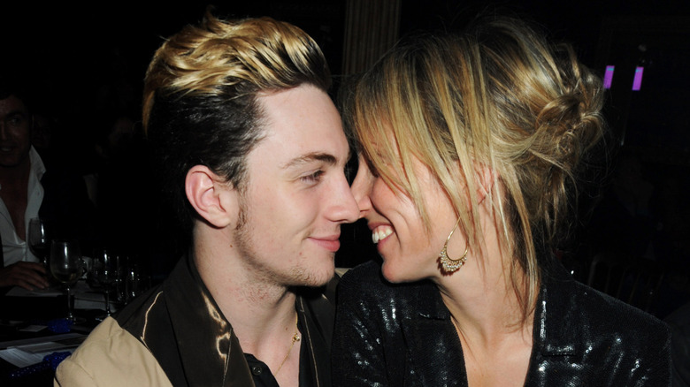 Aaron and Sam Taylor-Johnson kiss in 2009