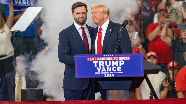 JD Vance Donald Trump behind podium