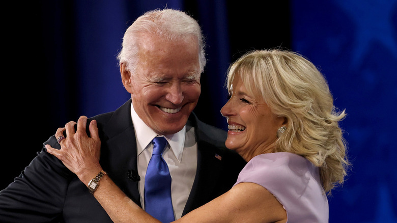 Jill and Joe Biden hug and laugh affectionately