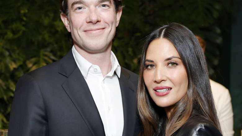 John Mulaney and Olivia Munn embracing