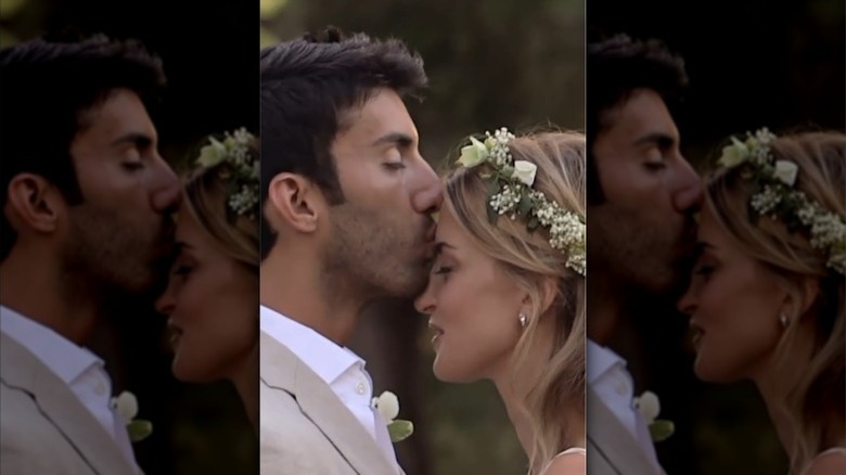 Justin Baldoni gives Emily Baldoni a forehead kiss at their 2013 wedding in Califronia