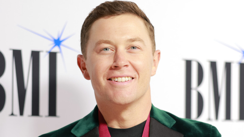 Scotty McCreery smiles at the 2024 BMI Country Awards in November 2024