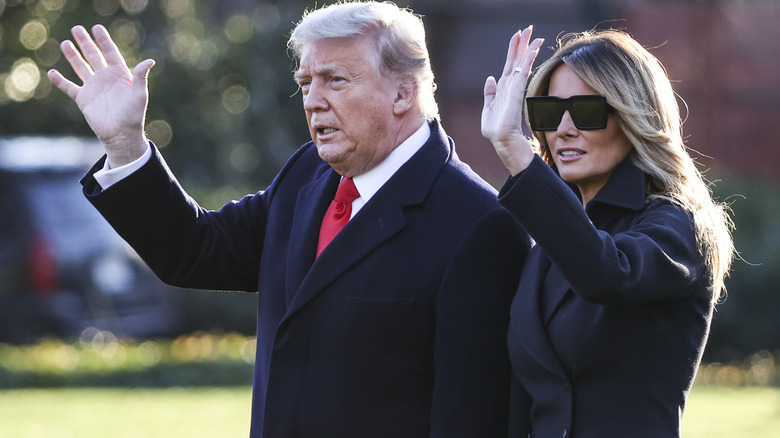 Donald and Melania Trump wave to crowds in 2020