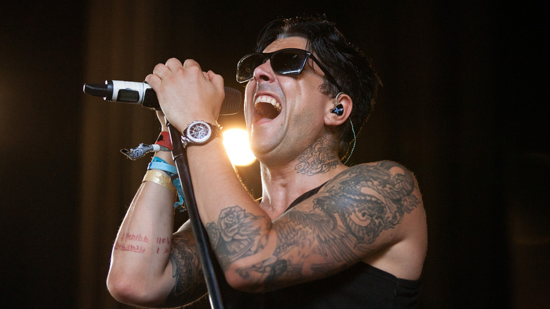 Ian Watkins singing into microphone