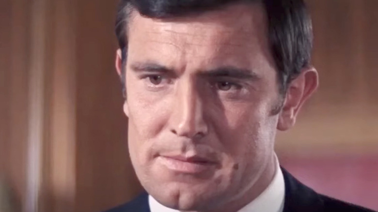 George Lazenby frowning