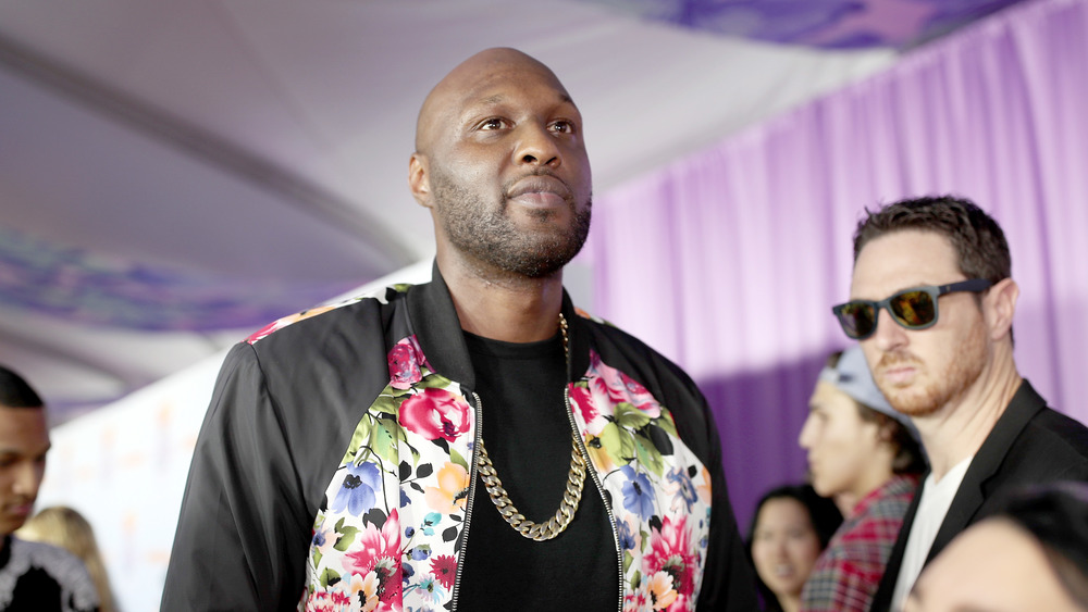 Lamar Odom lost in thought, walking red carpet