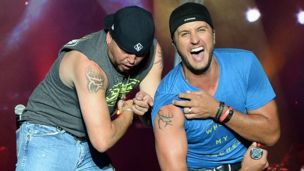 Jason Aldean and Luke Bryan showing off their ink