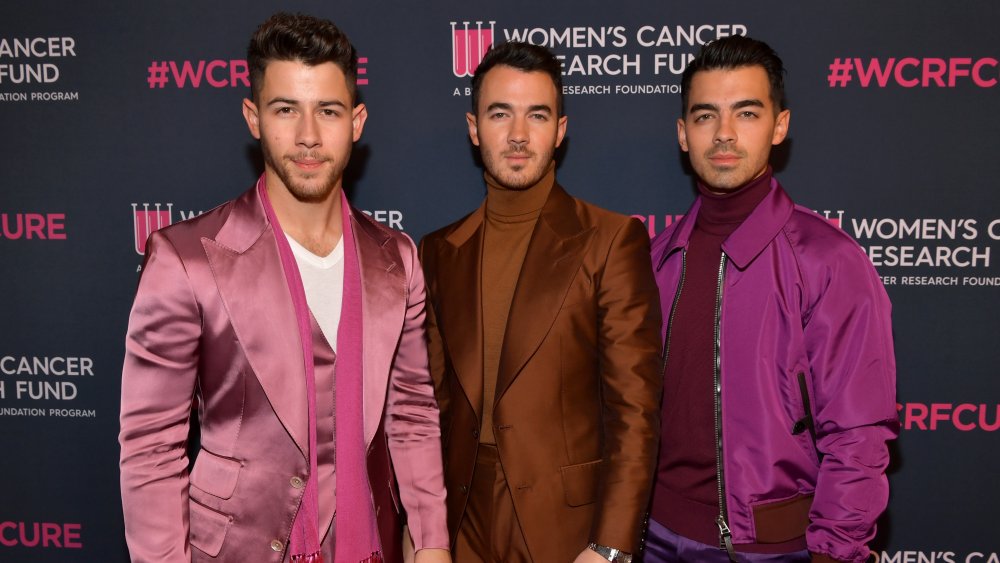 The Jonas Brothers posing on red carpet