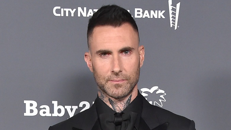 Adam Levine wearing a suit