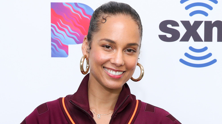 Alicia Keys wearing earrings