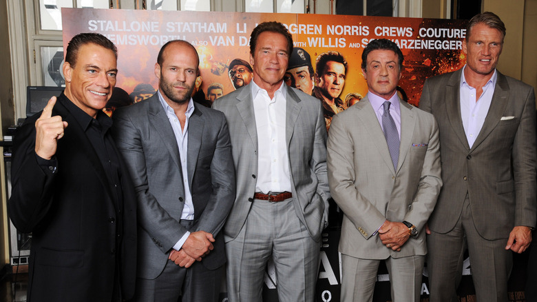 Jean-Claude Van Damme, Jason Statham, Arnold Schwarzenegger, Sylvester Stallone, Dolph Lundgren and Scott Adkins all posing