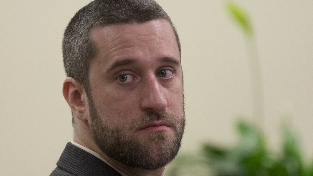 Dustin Diamond, looking sad, in court, wearing a suit