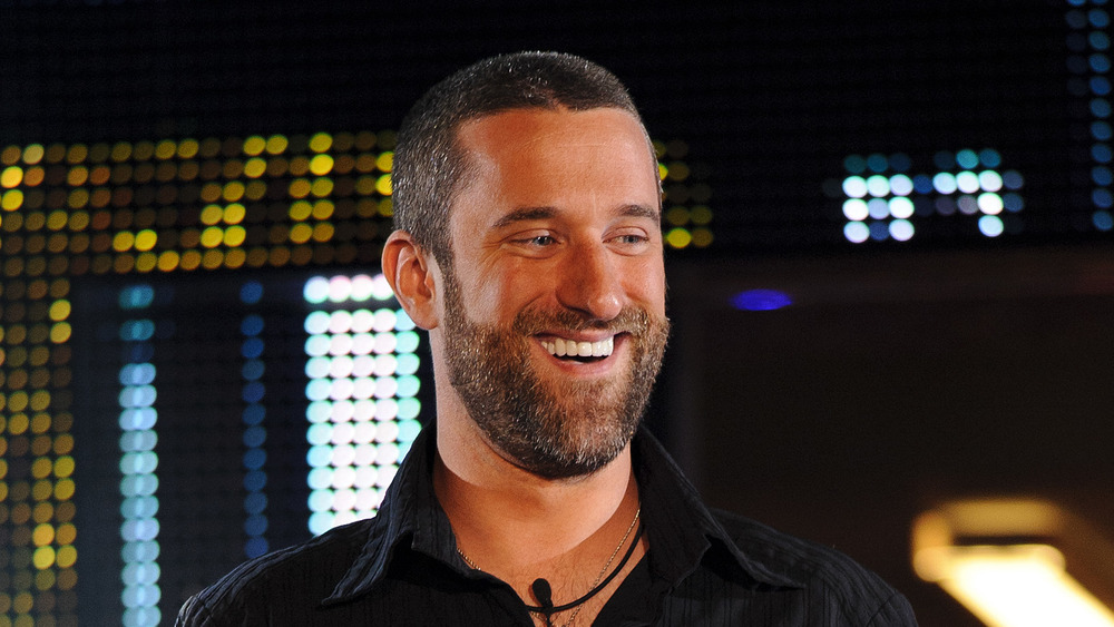 Dustin Diamond, smiling, black collared shirt 