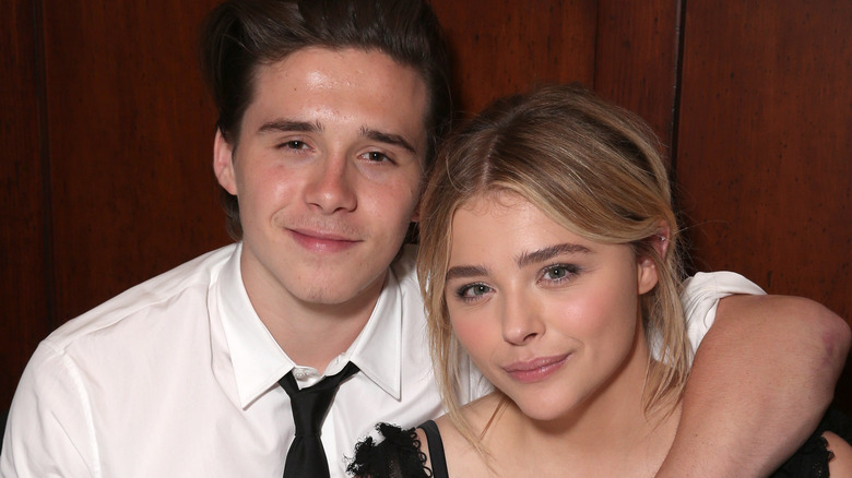 Brooklyn Beckham and Chloë Grace Moretz smiling