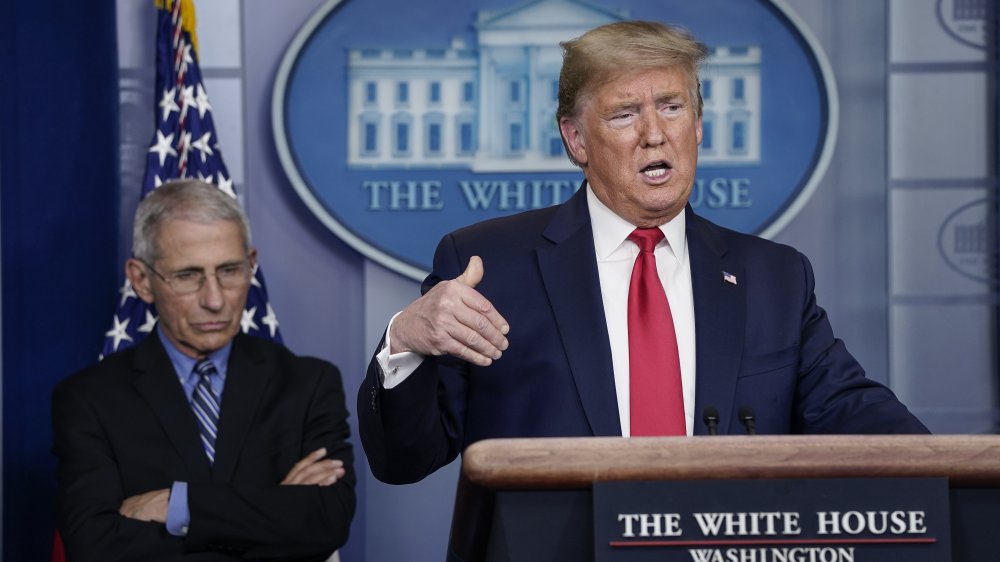 Dr. Anthony Fauci and Donald Trump at a briefing in 2020