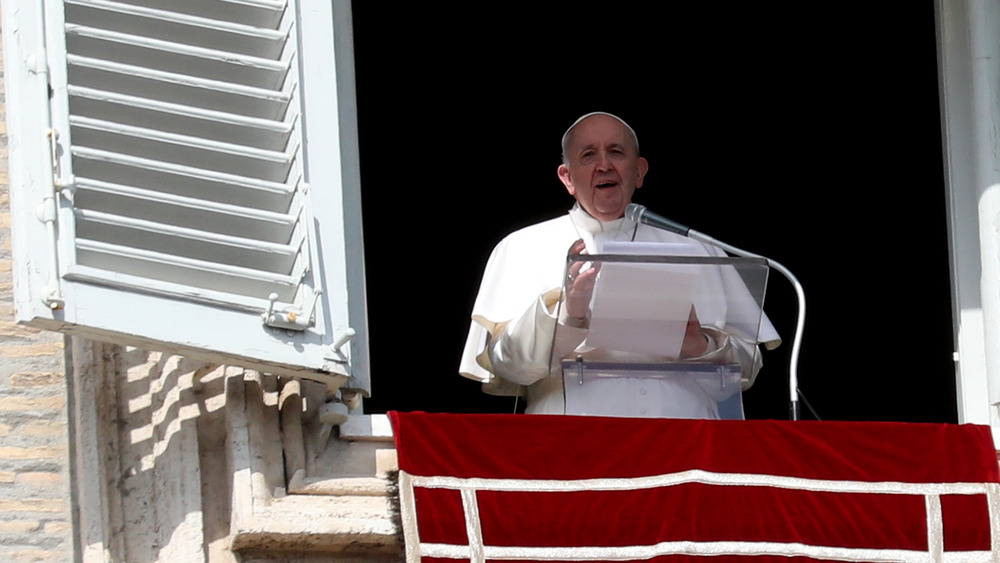 Pope Francis delivering blessing from private window