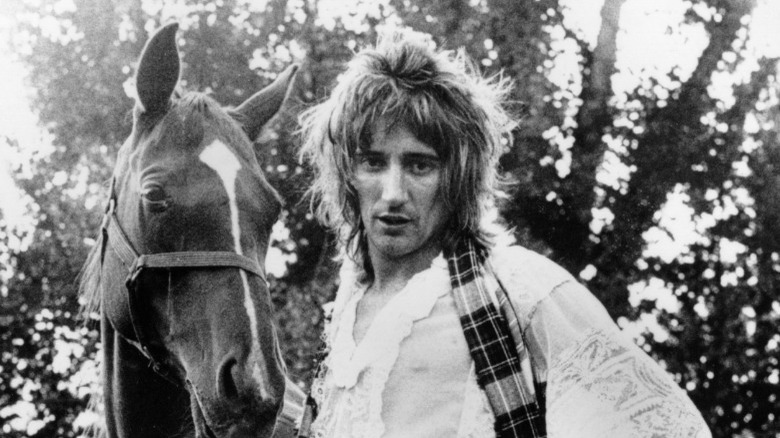 Rod Stewart posing with horse