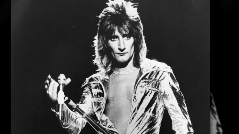 Rod Stewart holding mic 