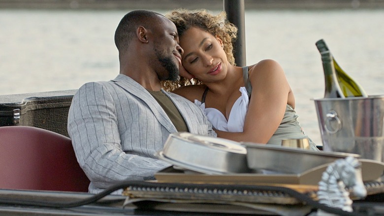 SK Alagbada and Raven Ross smiling on a boat trip