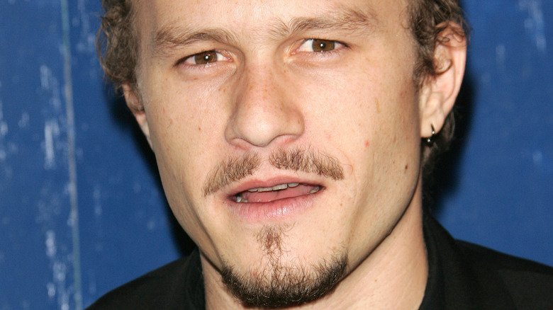 Heath ledger looking at camera