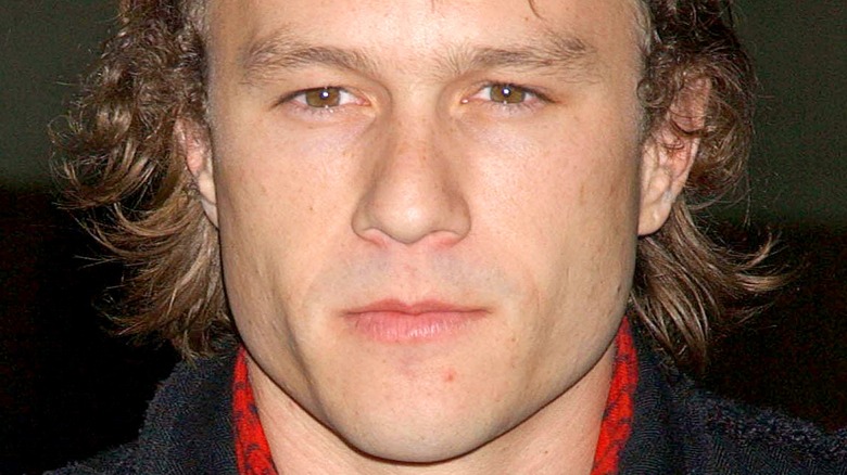 Heath Ledger posing on red carpet