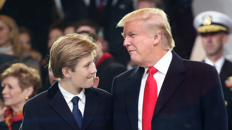 Barron Trump and Donald Trump at an event