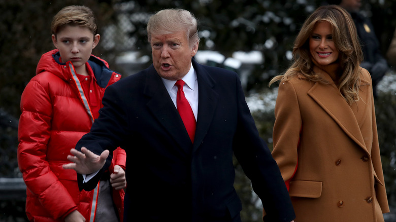 Barron Trump and Donald Trump outside