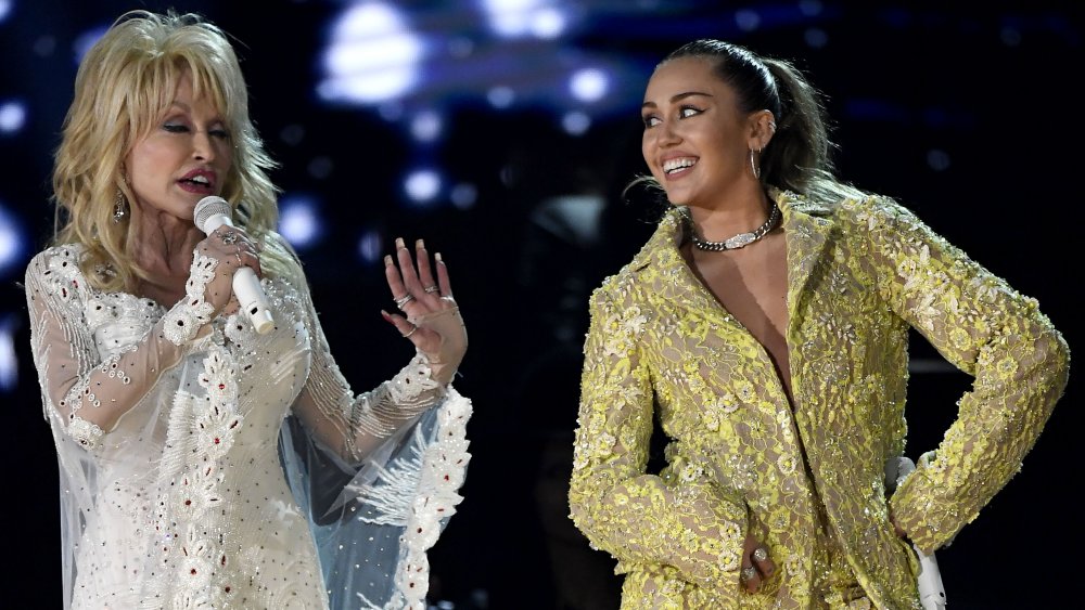 Dolly Parton and Miley Cyrus on stage