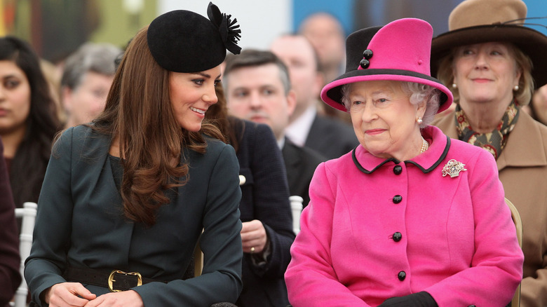 Kate Middleton and the queen attending a service