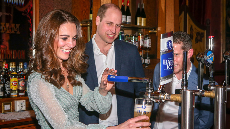 Kate Middleton drawing a beer next to Prince William