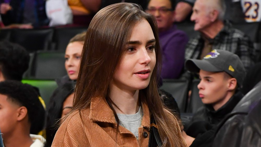 Lily Collins courtside 