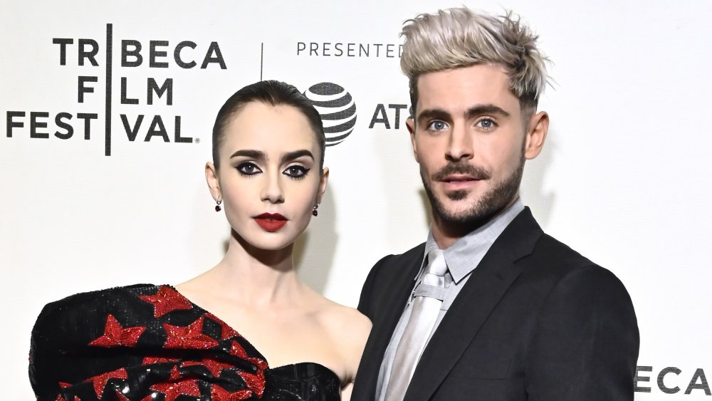 Lily Collins and Zac Efron at a red carpet premiere 