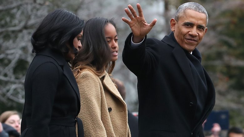 Michelle, Malia, and Barack Obama walking