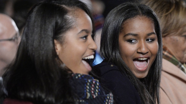 Malia and Sasha Obama laughing