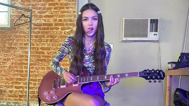 Olivia Rodrigo playing guitar