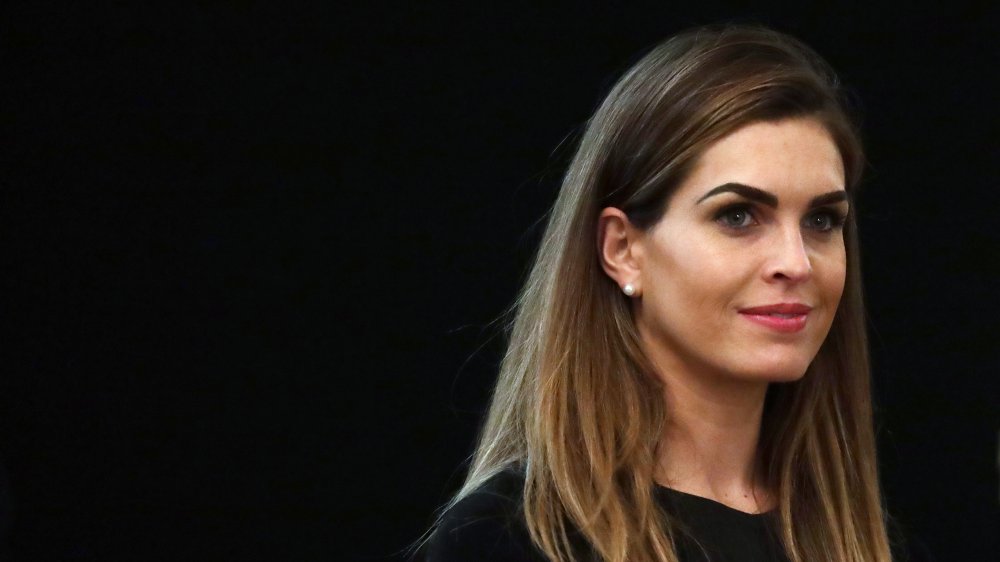 Hope Hicks with a small smile, looking ahead