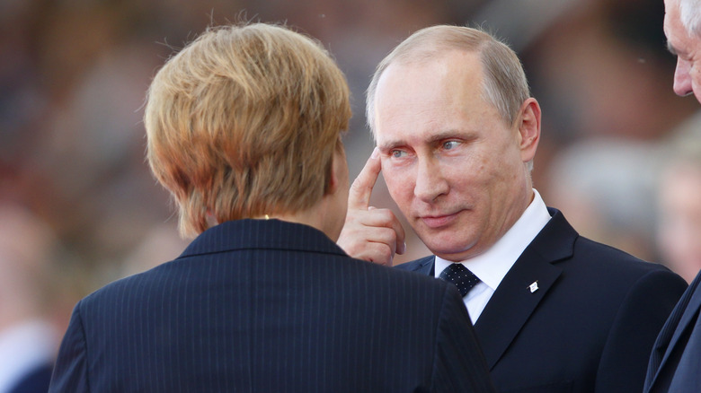 German Chancellor Angela Merkel and Vladimir Putin.