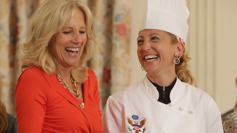 Jill Biden laughing with assistant pastry chef in 2021