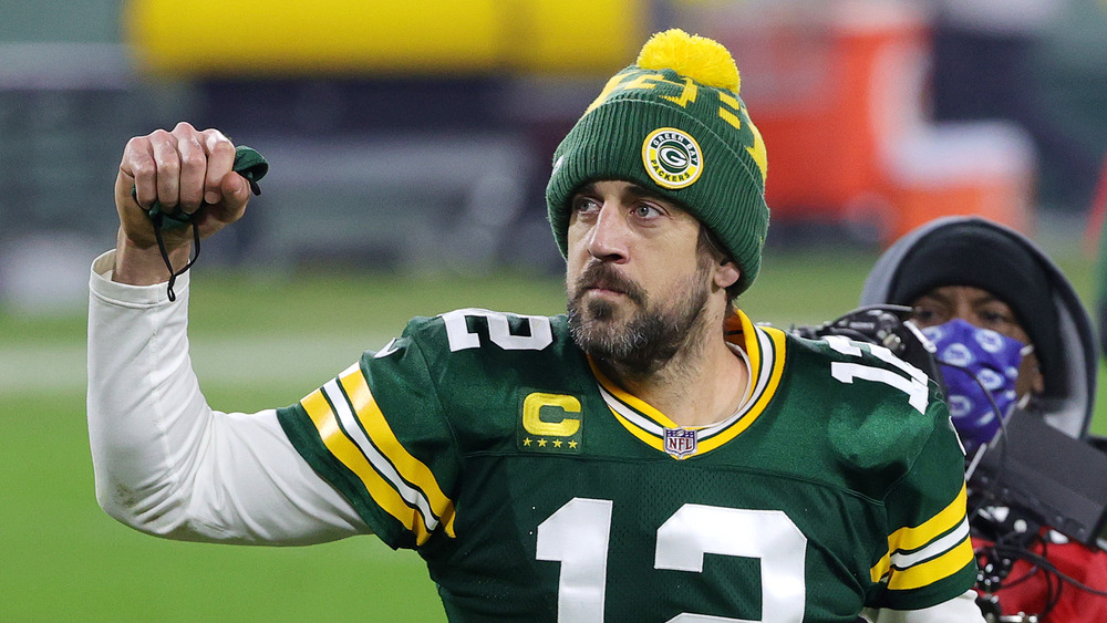 Aaron Rodgers celebrates defeating the Los Angeles Rams