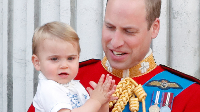 Prince William holding Prince Louis of Wales